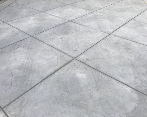 this image shows stamped concrete driveway patio